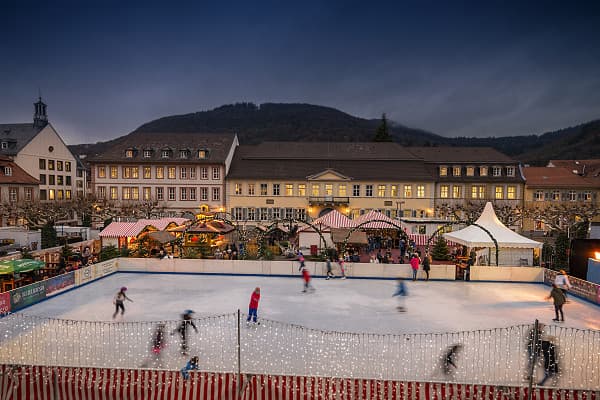 Visitors on an ice rink at the Christmas market